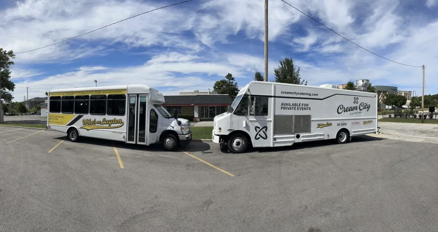 One of the shuttles parked beside the Cream City catering truck