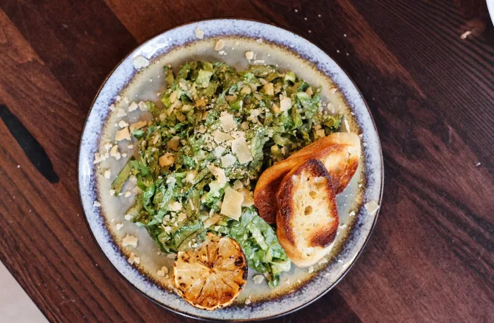 Chopped kale salad with grilled crostini