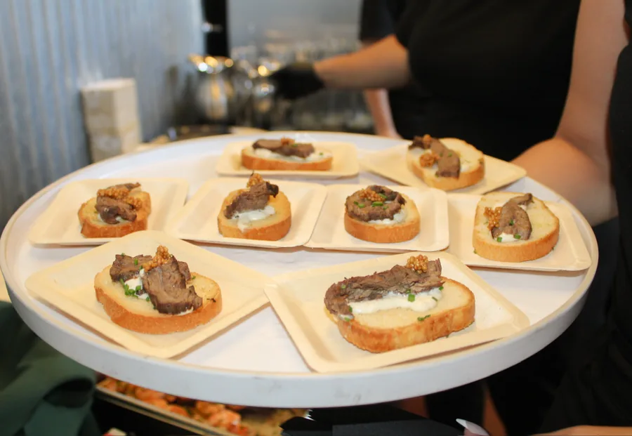 A tray of steak crostini with horseradish cream
