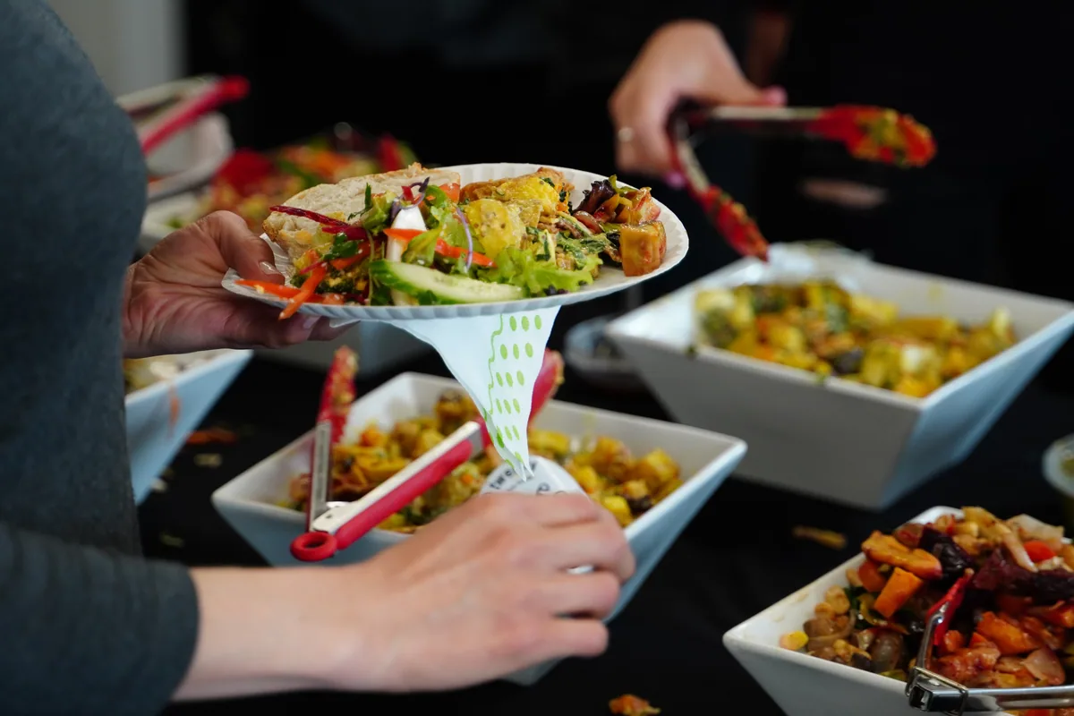 A chef-attended buffet line being served at an event